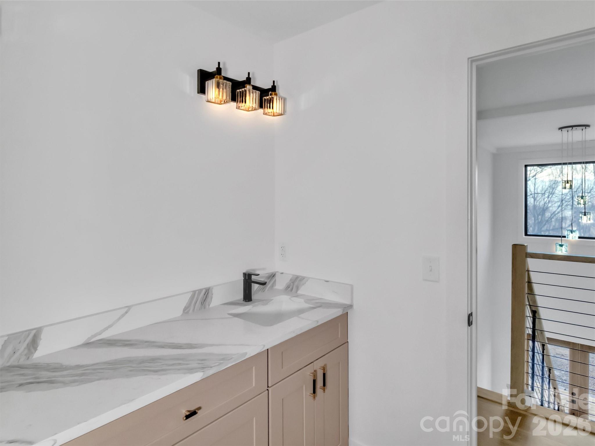 1351 Old Country Road Waynesville, NC 28786 - Photo 19 of 28 a bathroom with a sink and a mirror