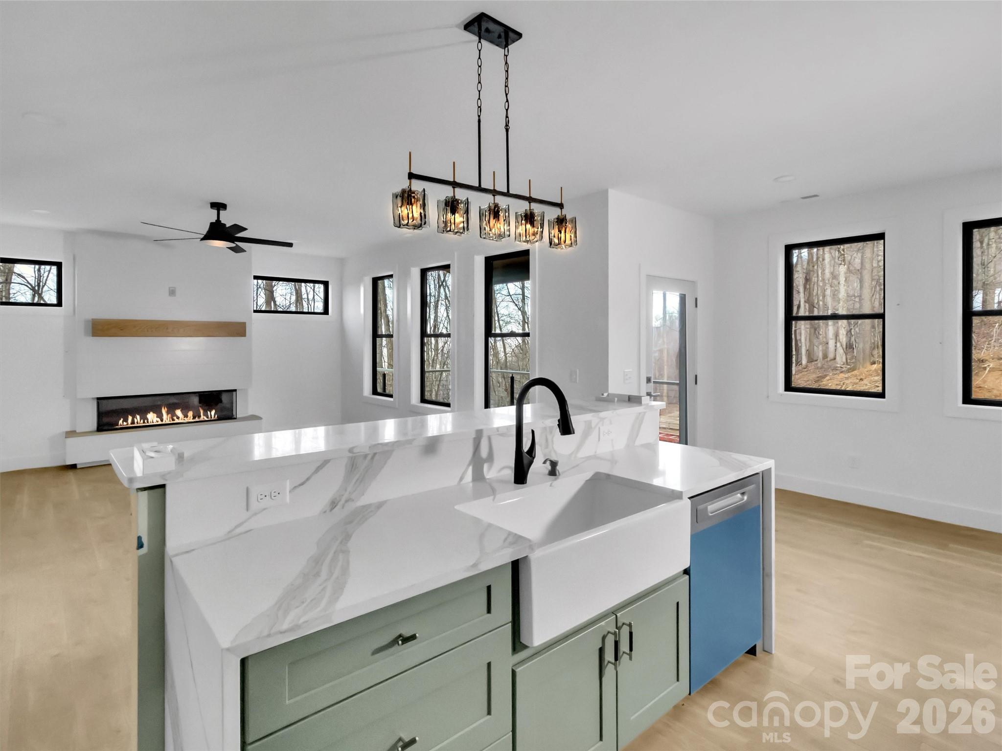 1351 Old Country Road Waynesville, NC 28786 - Photo 3 of 28 a kitchen with stainless steel appliances a sink stove and refrigerator