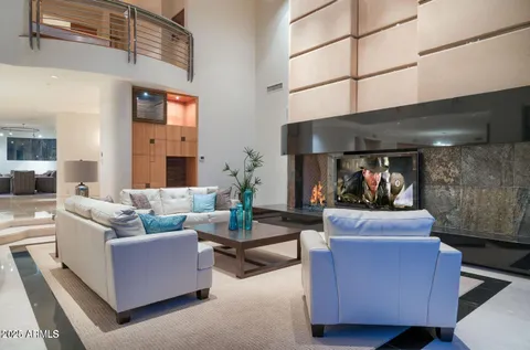 a kitchen with stainless steel appliances a refrigerator and table chair