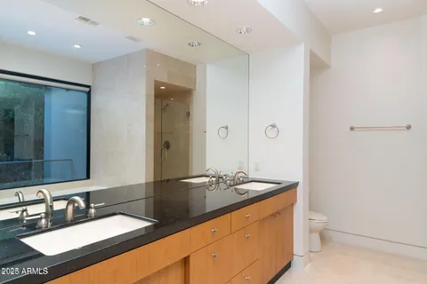 a bathroom with a toilet and a sink