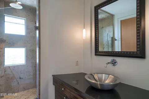 a view of a patio with a dining table and chairs