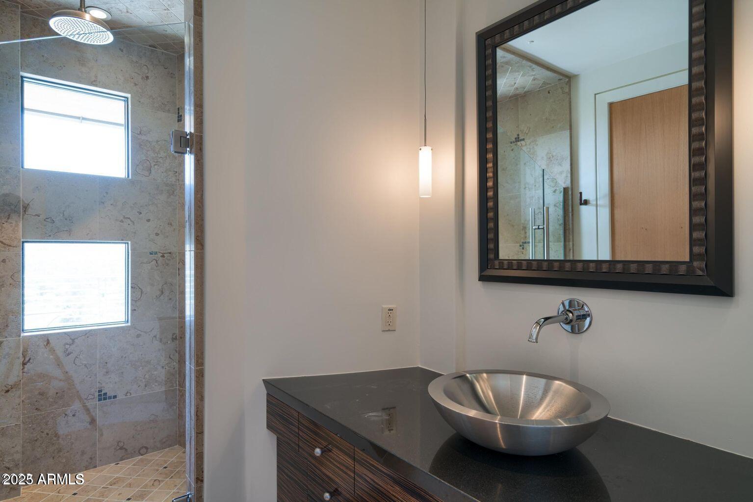 4550 East Foothill Drive Paradise Valley, AZ 85253 - Photo 48 of 58 a bathroom with a sink and a mirror