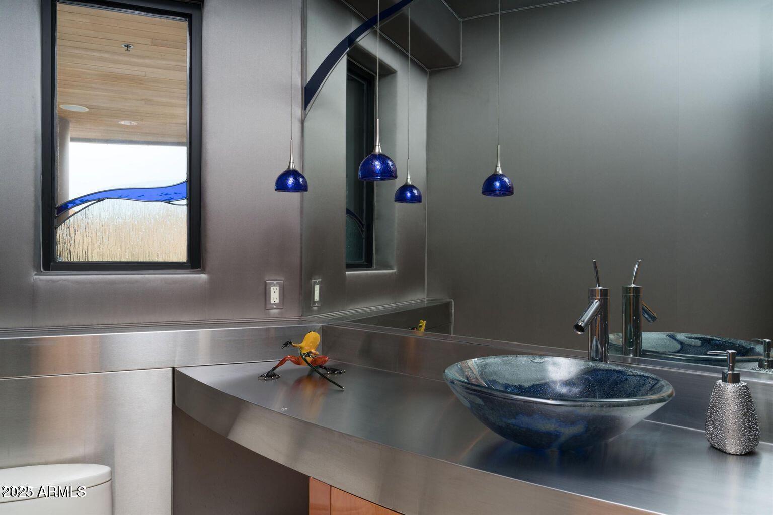 4550 East Foothill Drive Paradise Valley, AZ 85253 - Photo 49 of 58 a bathroom with a toilet and a sink