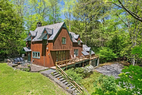 a backyard of a house with lots of green space
