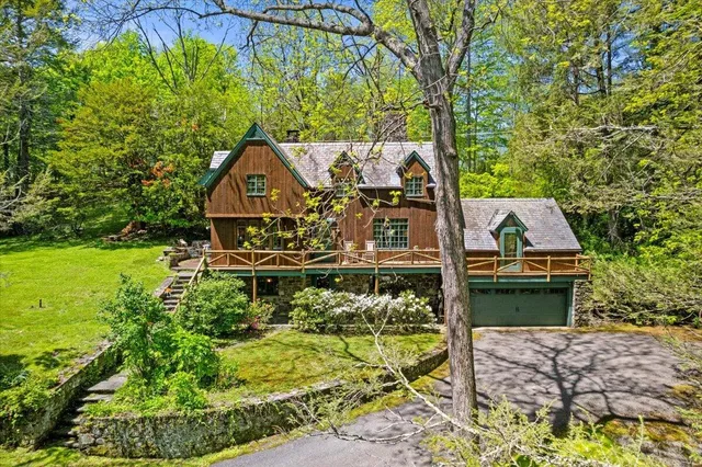 a kitchen with stainless steel appliances granite countertop a refrigerator and a stove