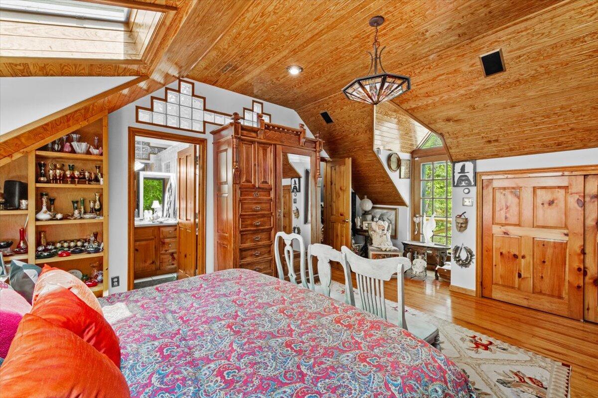 1341 Beaver Valley Road Stroudsburg, PA 18360 - Photo 50 of 84 a bedroom with a bed and a wooden floor