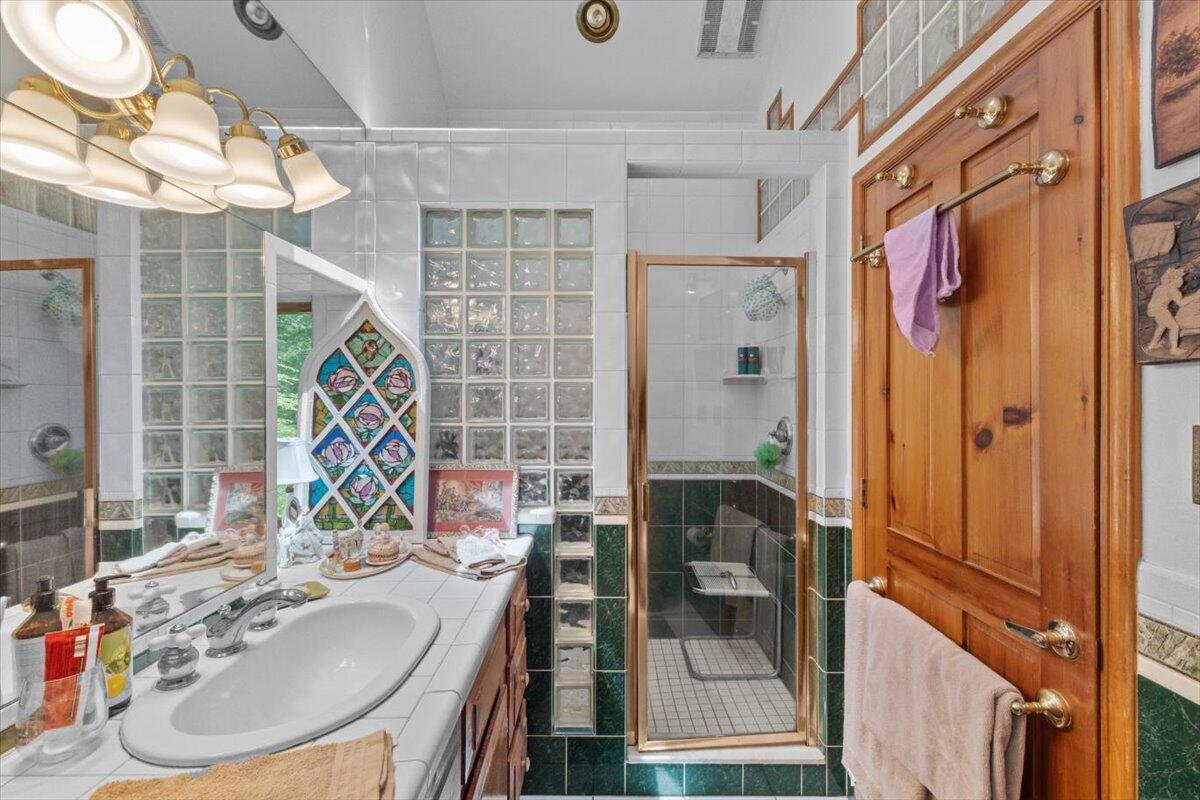 1341 Beaver Valley Road Stroudsburg, PA 18360 - Photo 52 of 84 a bathroom with a sink and a mirror