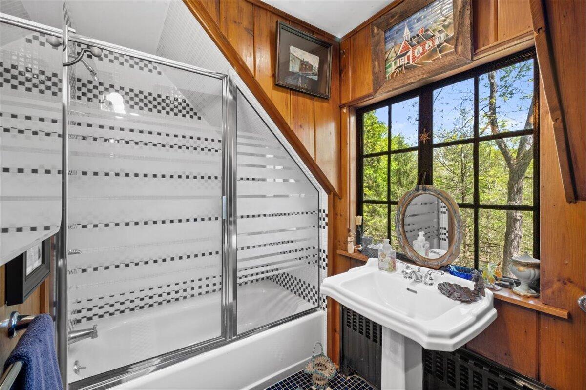 1341 Beaver Valley Road Stroudsburg, PA 18360 - Photo 60 of 84 a bathroom with a table a mirror and window