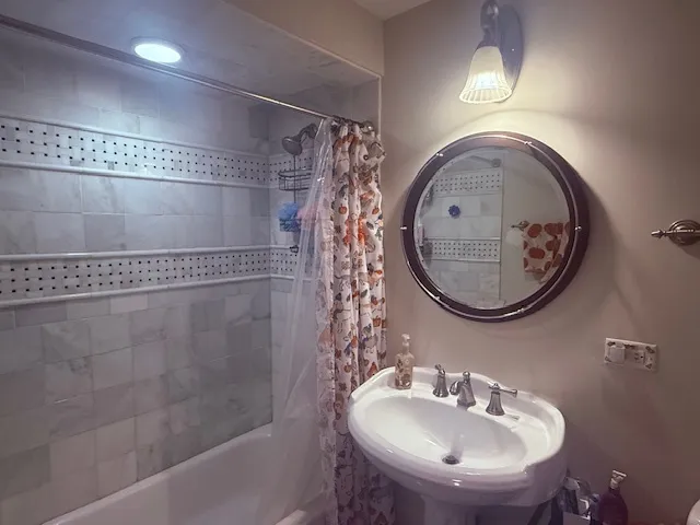 a bathroom with a sink and a mirror