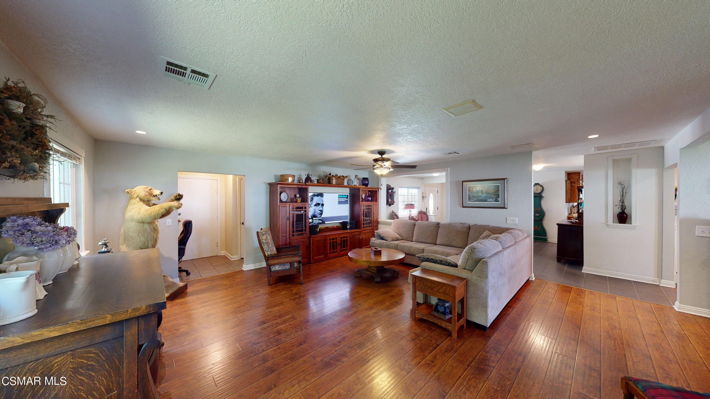 4865 Leeds Street Simi Valley, CA 93063 - Photo 14 of 91 a living room with furniture hard wood floor and a table
