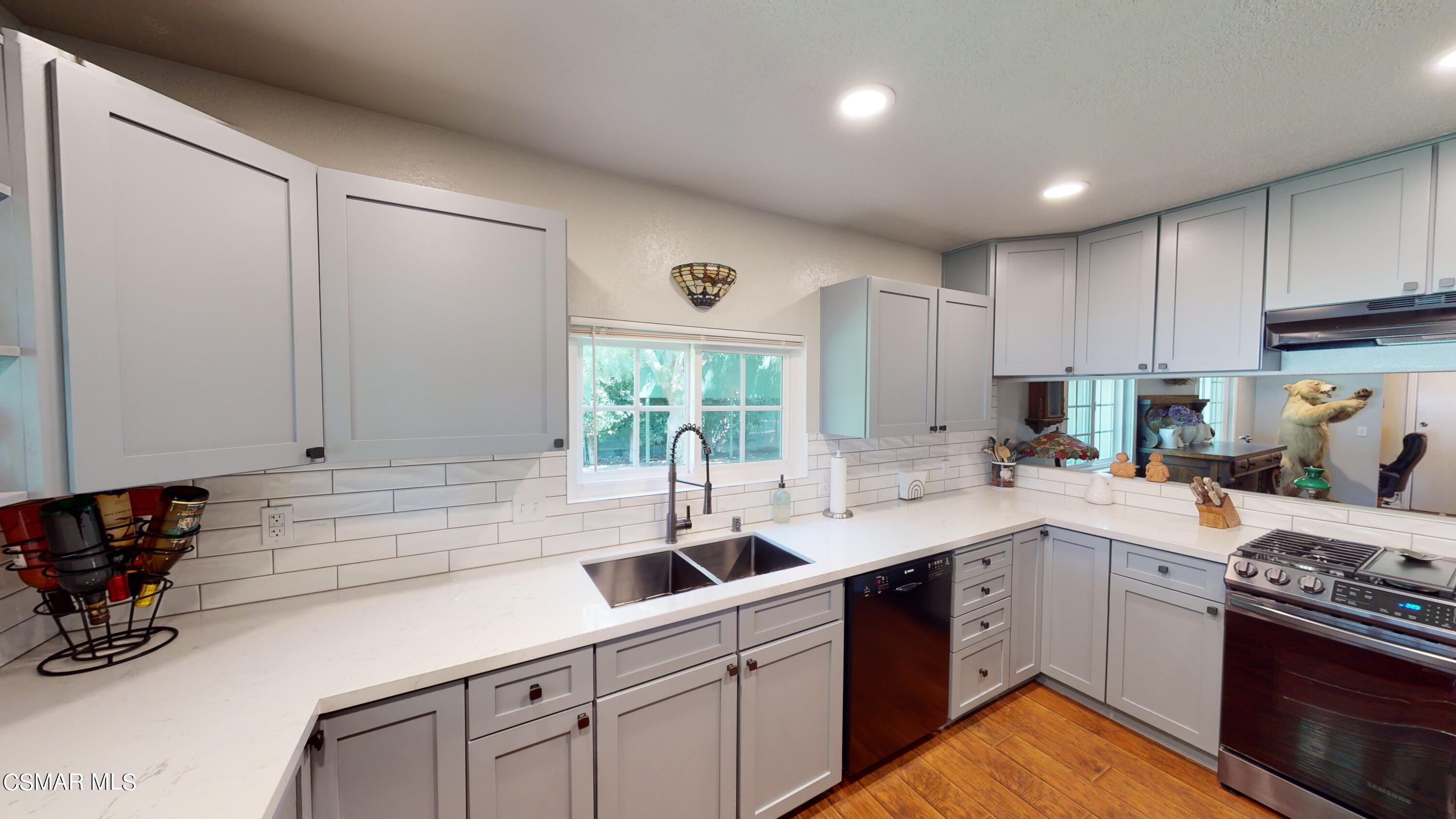 4865 Leeds Street Simi Valley, CA 93063 - Photo 20 of 91 a kitchen with a sink stove and cabinets