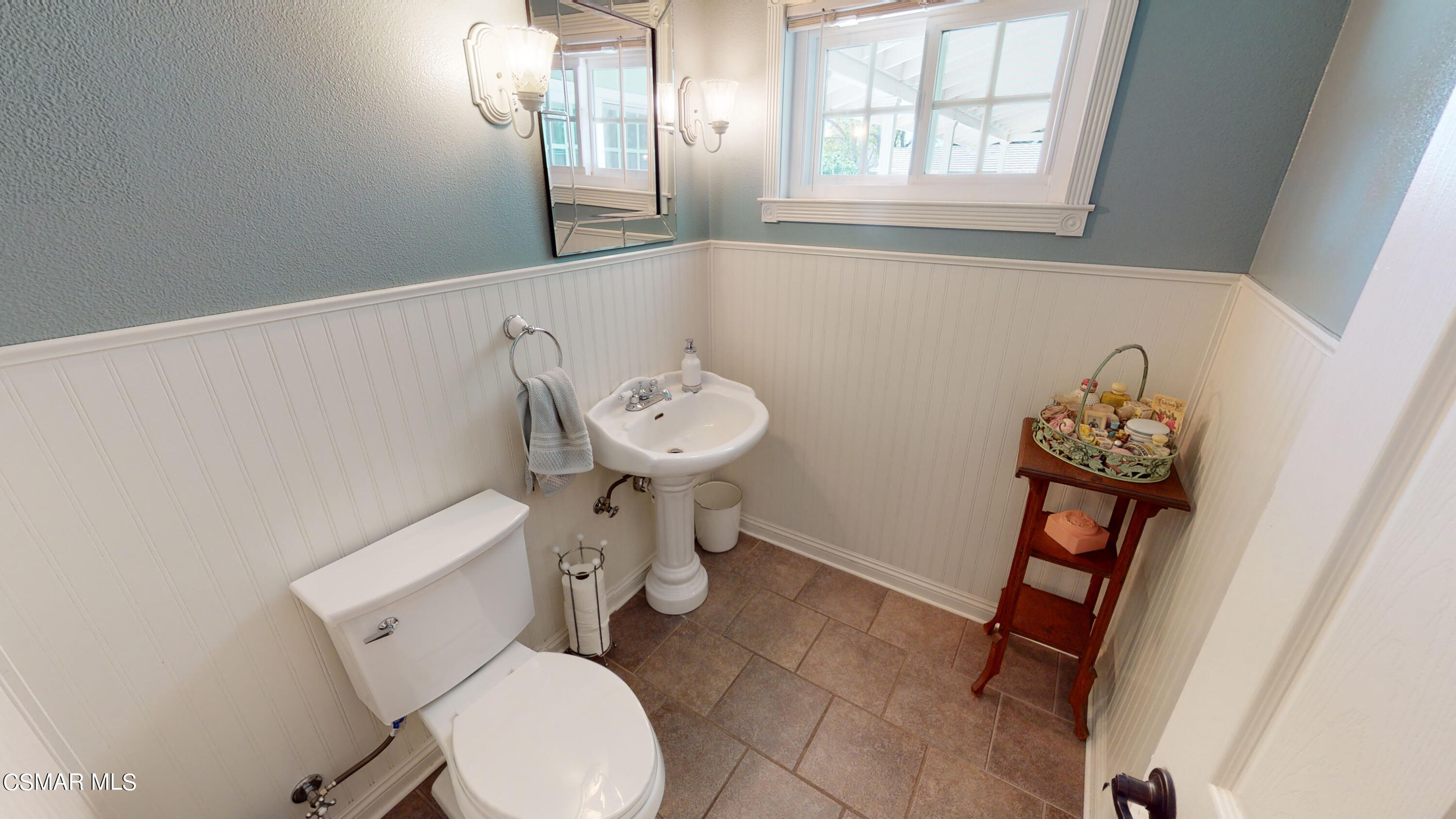 4865 Leeds Street Simi Valley, CA 93063 - Photo 23 of 91 a bathroom with a toilet sink and mirror