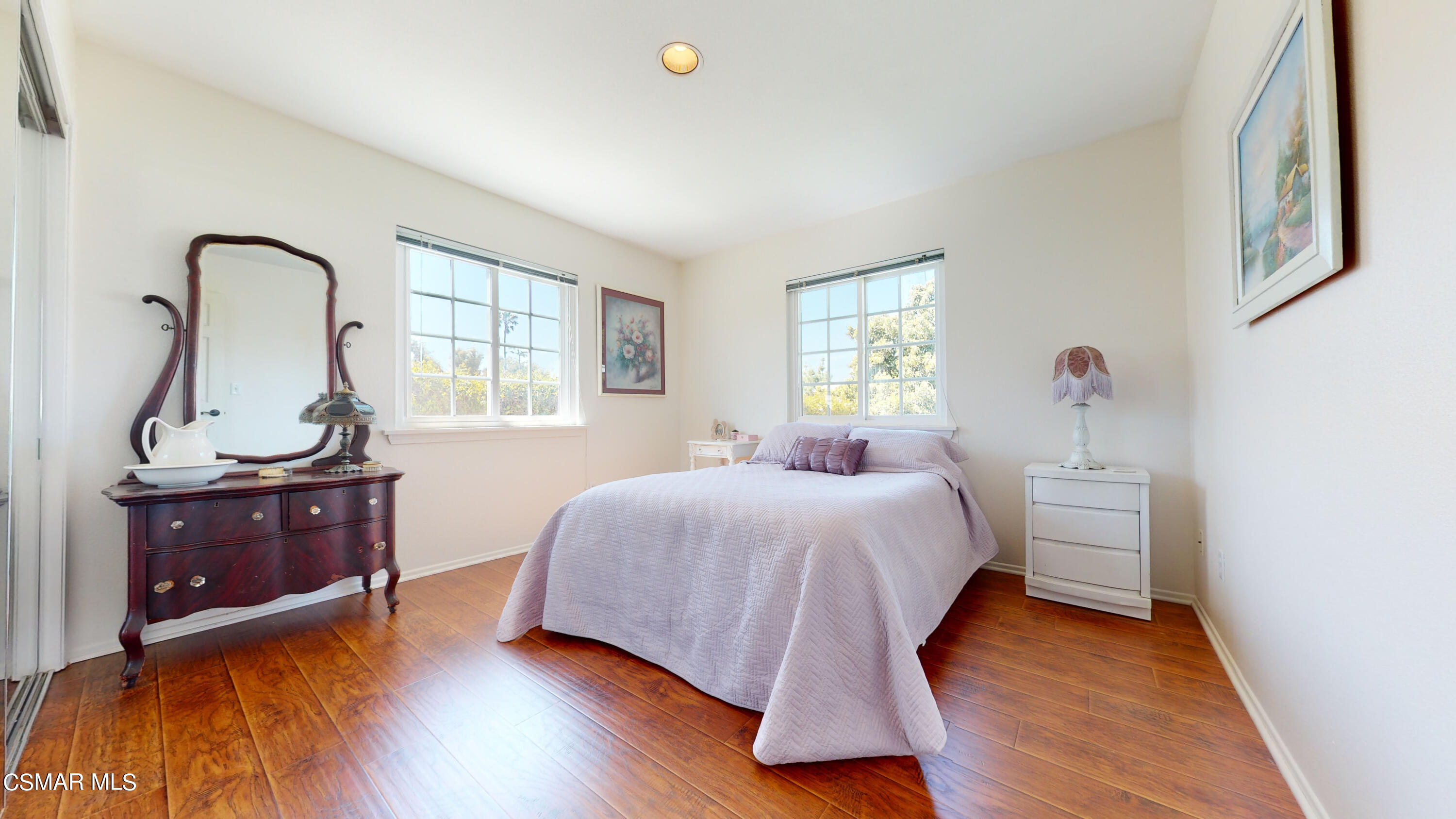 4865 Leeds Street Simi Valley, CA 93063 - Photo 29 of 91 a bedroom with a bed and wooden floor