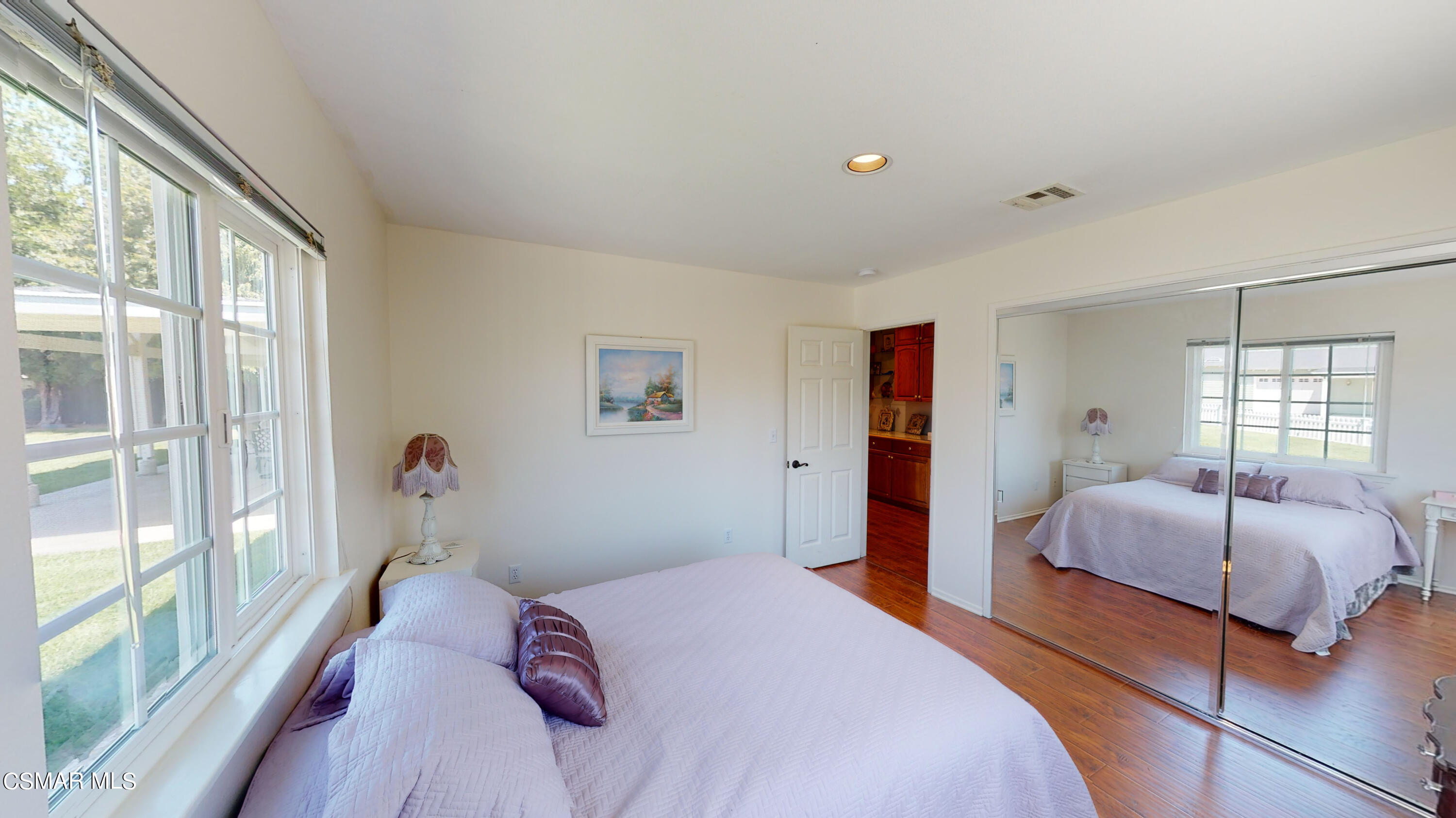 4865 Leeds Street Simi Valley, CA 93063 - Photo 30 of 91 a bedroom with a bed and a large window