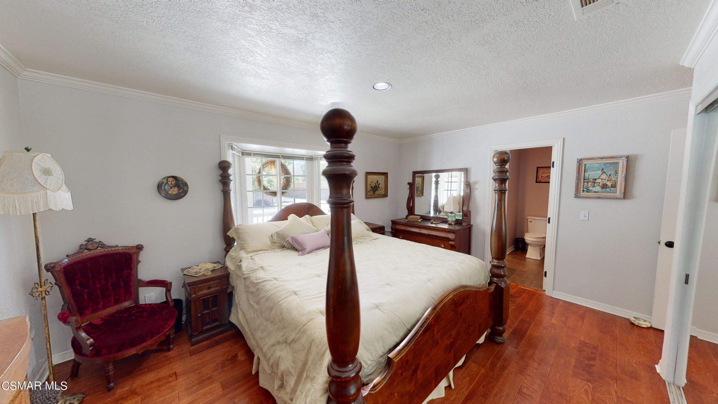 4865 Leeds Street Simi Valley, CA 93063 - Photo 35 of 91 a bed room with a bed and a chair