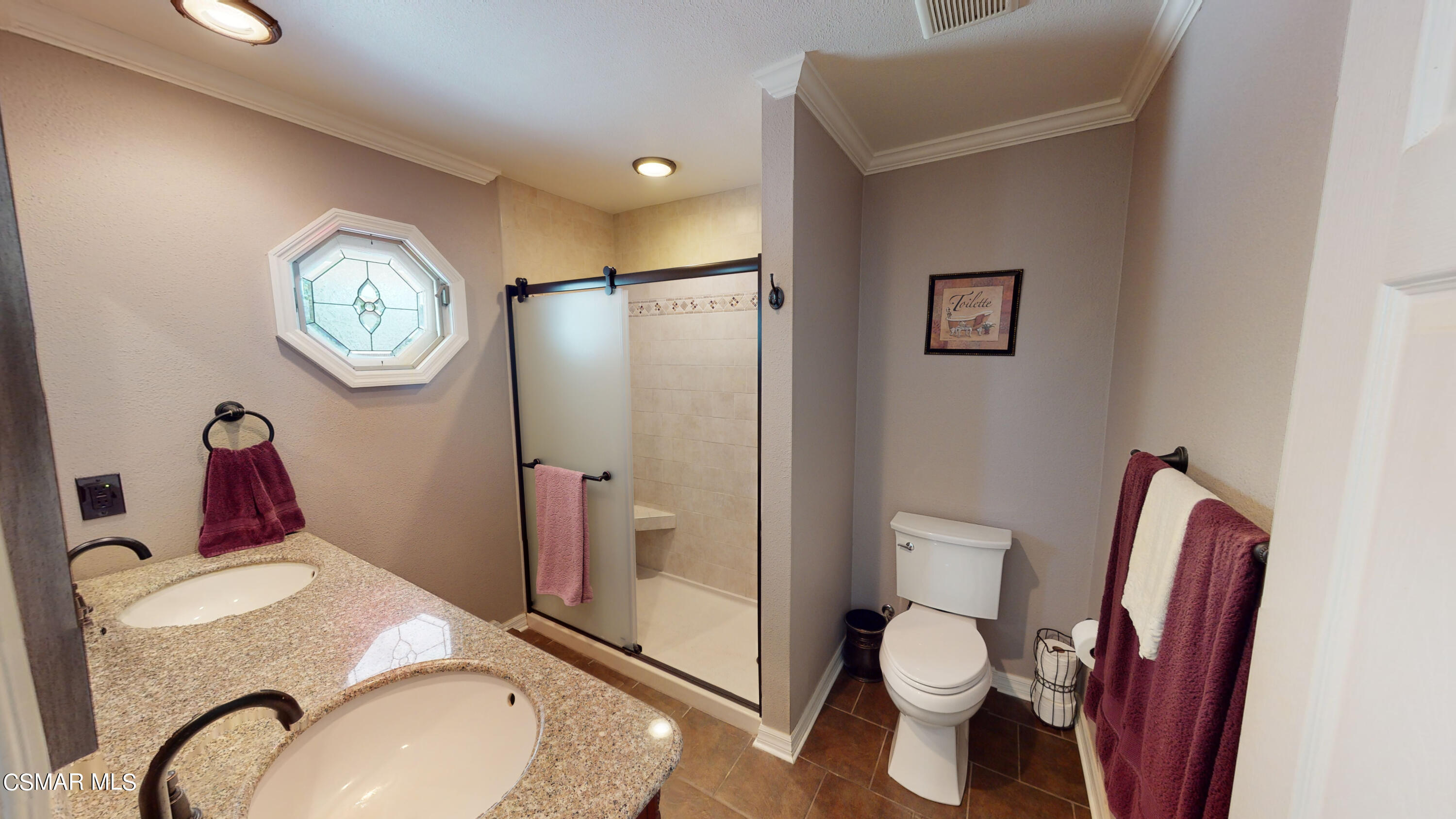 4865 Leeds Street Simi Valley, CA 93063 - Photo 37 of 91 a bathroom with a granite countertop toilet and a sink