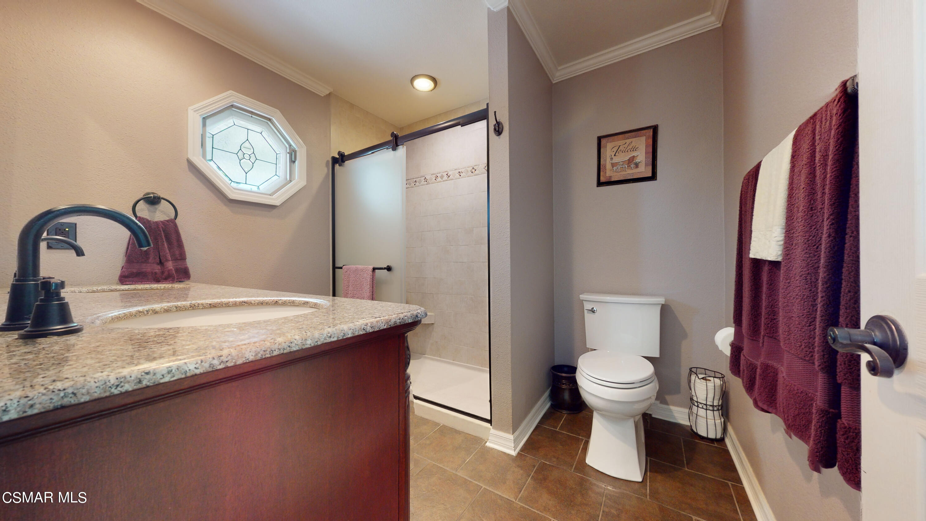 4865 Leeds Street Simi Valley, CA 93063 - Photo 40 of 91 a bathroom with a granite countertop sink a toilet and a mirror