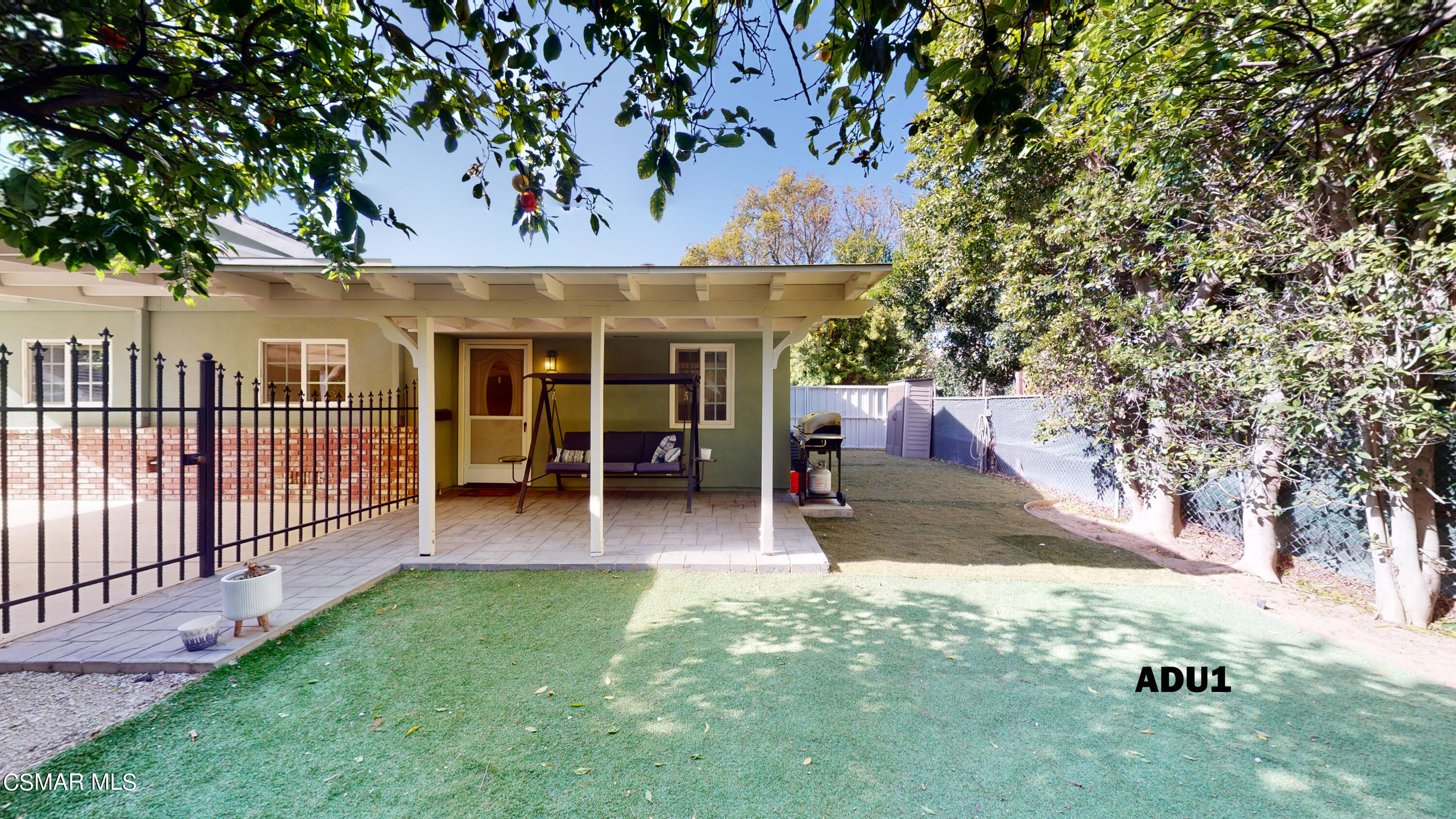 4865 Leeds Street Simi Valley, CA 93063 - Photo 44 of 91 a view of a patio with table and chairs a barbeque and a large tree