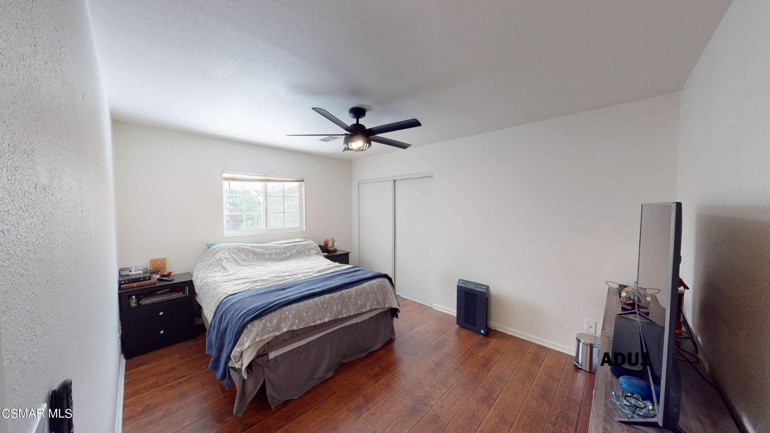 4865 Leeds Street Simi Valley, CA 93063 - Photo 50 of 91 a bedroom with a bed and a flat screen tv