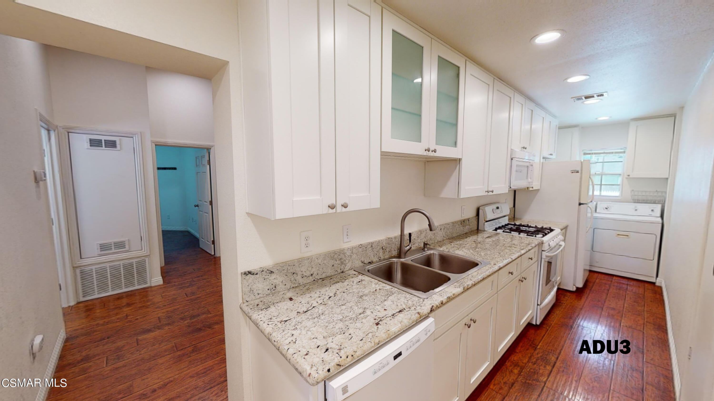 4865 Leeds Street Simi Valley, CA 93063 - Photo 68 of 91 a kitchen with a sink a stove and cabinets