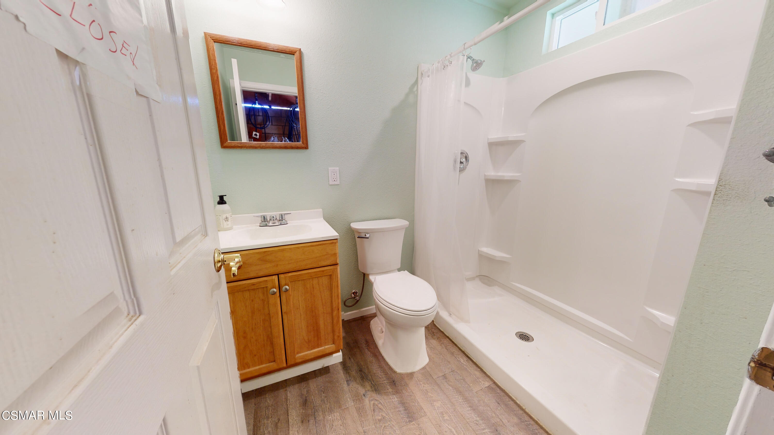 4865 Leeds Street Simi Valley, CA 93063 - Photo 79 of 91 a bathroom with a toilet sink and a shower