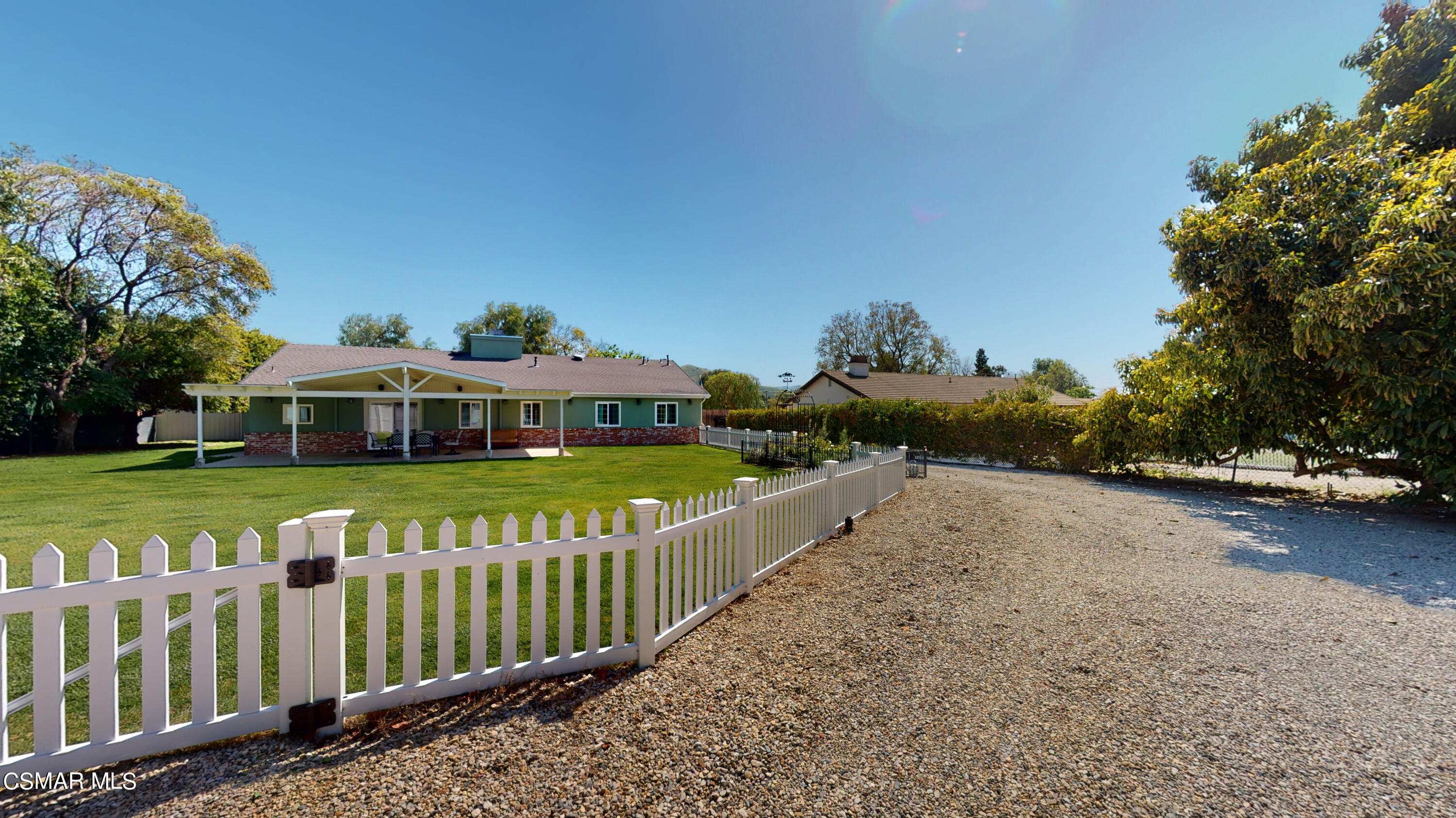 4865 Leeds Street Simi Valley, CA 93063 - Photo 85 of 91 a view of a house with a yard