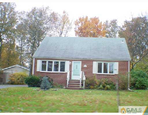 93 Highland Road Colonia, NJ 07067 - Photo 3 of 3 a house that has a yard