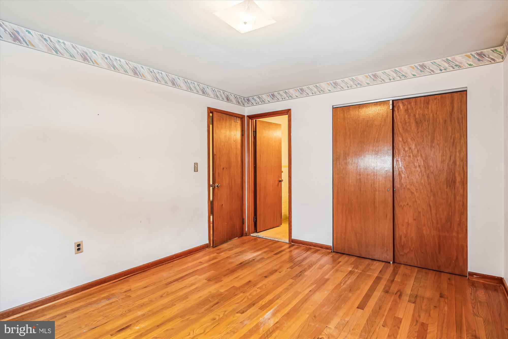 1418 Larch Road Severn, MD 21144 - Photo 19 of 36 a view of empty room with wooden floor and fan