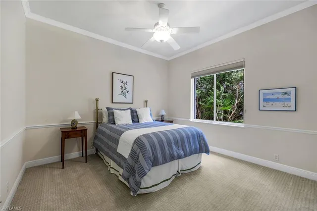 a bed room with a bed and a chandelier