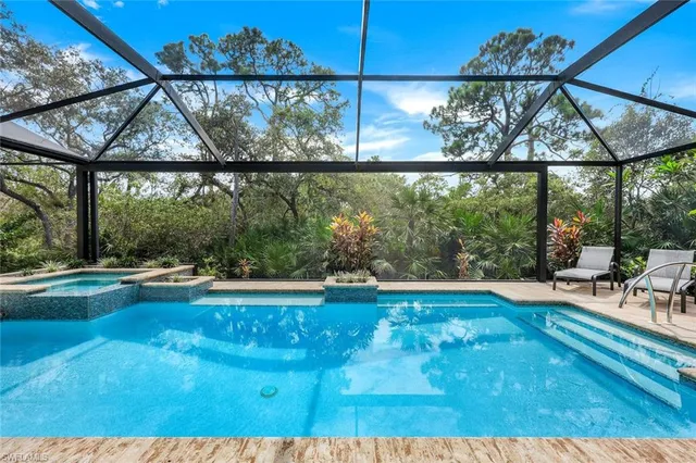 a view of swimming pool from a living room