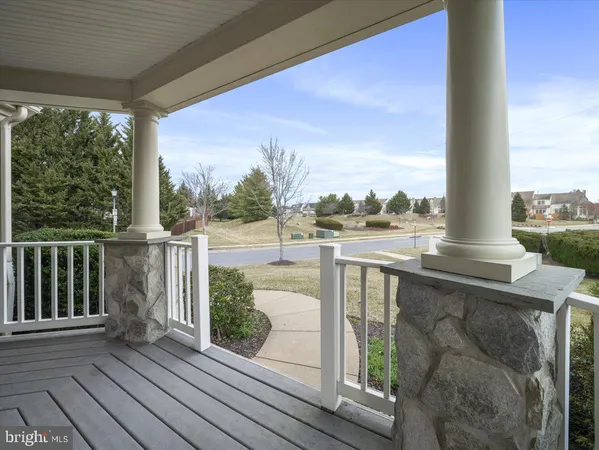 a view of a bedroom with wooden floor and a window