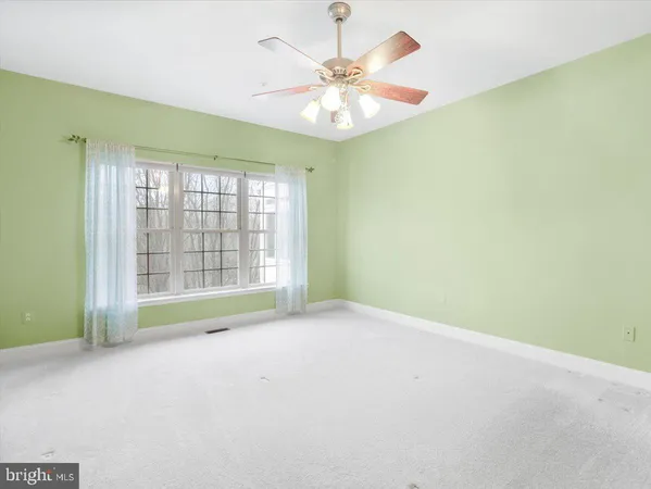a view of a balcony with wooden floor