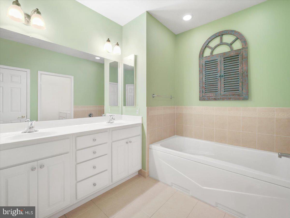 2601 Mill Race Road Frederick, MD 21701 - Photo 28 of 82 a bathroom with a tub sink and mirror