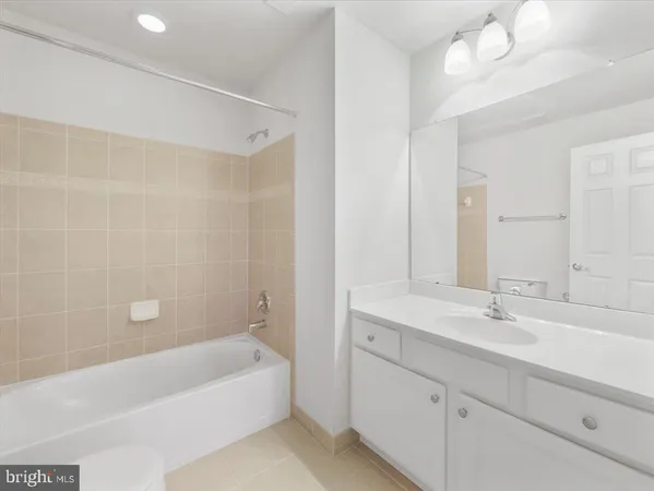 a view of a field with trees in the background