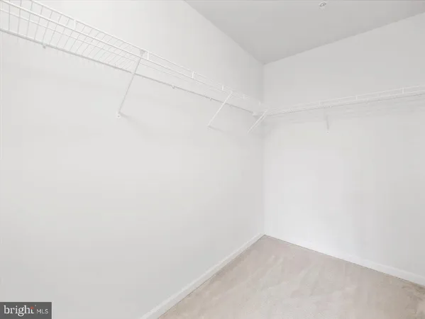 a living room with furniture a table and a large window
