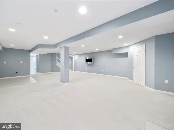 a view of a swimming pool with outdoor seating