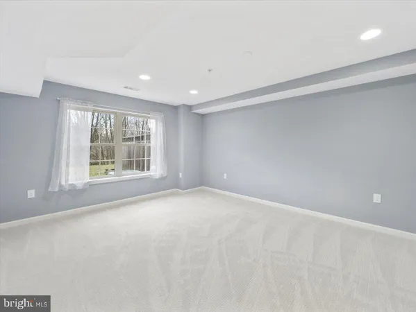 a view of a white house with a yard