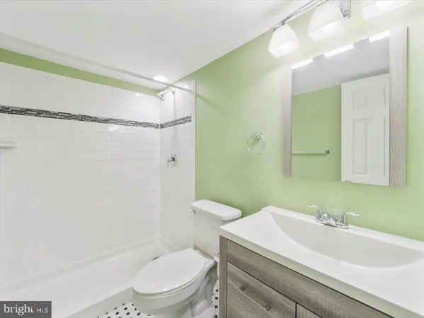 a view of a yard with snow on the road