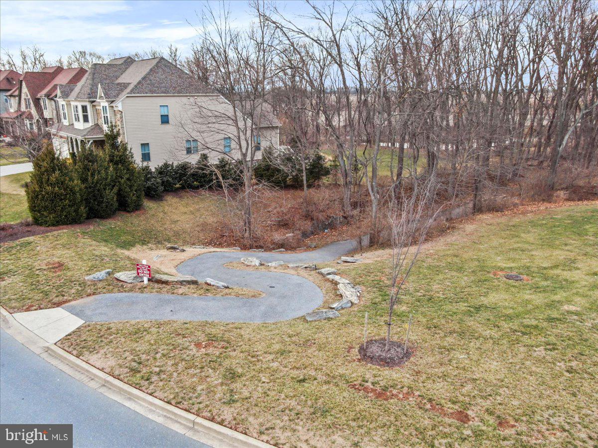 2601 Mill Race Road Frederick, MD 21701 - Photo 70 of 82 a view of a white house with a yard