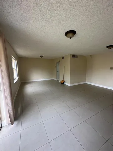 a view of empty room with windows