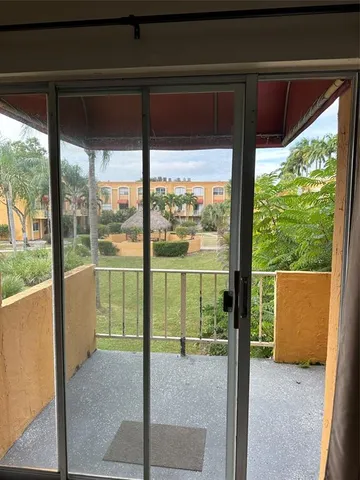 a view of a room with a large window