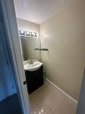 a bathroom with a sink and mirror