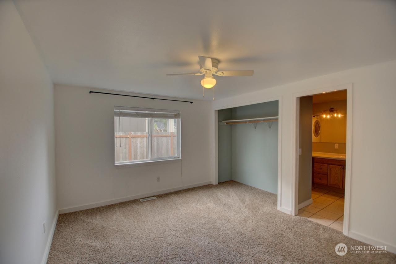 1321 Golf Club Road Southeast Lacey, WA 98503 - Photo 12 of 25 a view of an empty room with a window