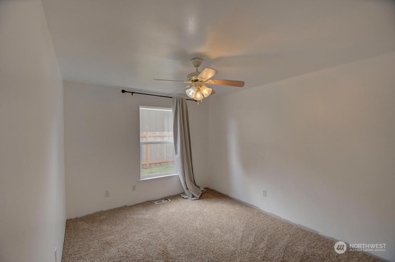 1321 Golf Club Road Southeast Lacey, WA 98503 - Photo 18 of 25 a view of an empty room with a window