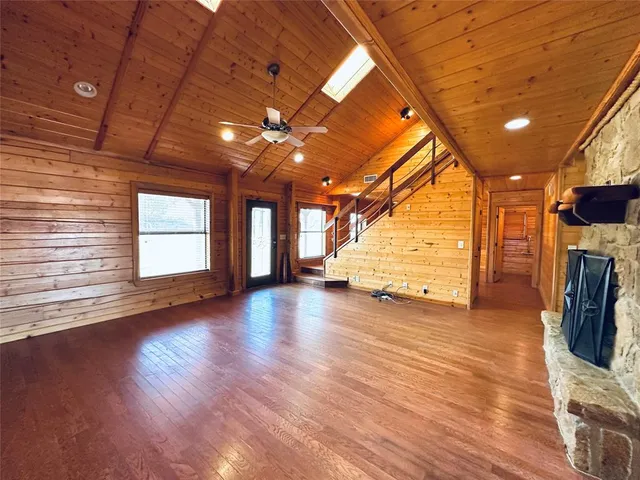 a view of a livingroom with wooden floor