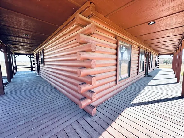 a view of outdoor space with wooden floor and staircase