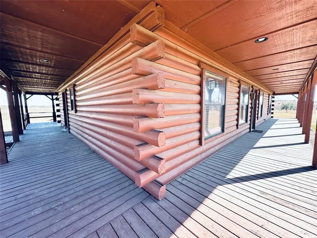 a view of outdoor space with wooden floor and staircase