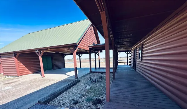a view of a house with wooden deck