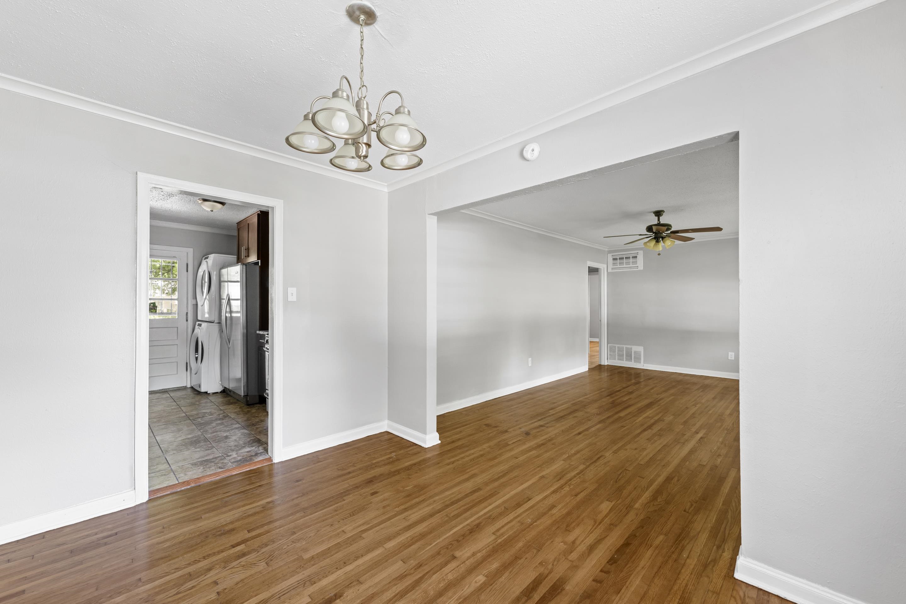 1418 South Perkins Road Memphis, TN 38117 - Photo 10 of 21 wooden floor in an empty room with a window