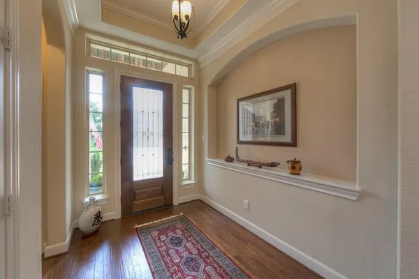 a view of room with window and wooden floor